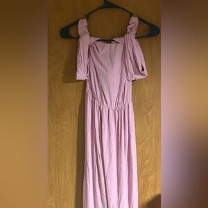 Pink off the shoulder maternity dress with leg slit.